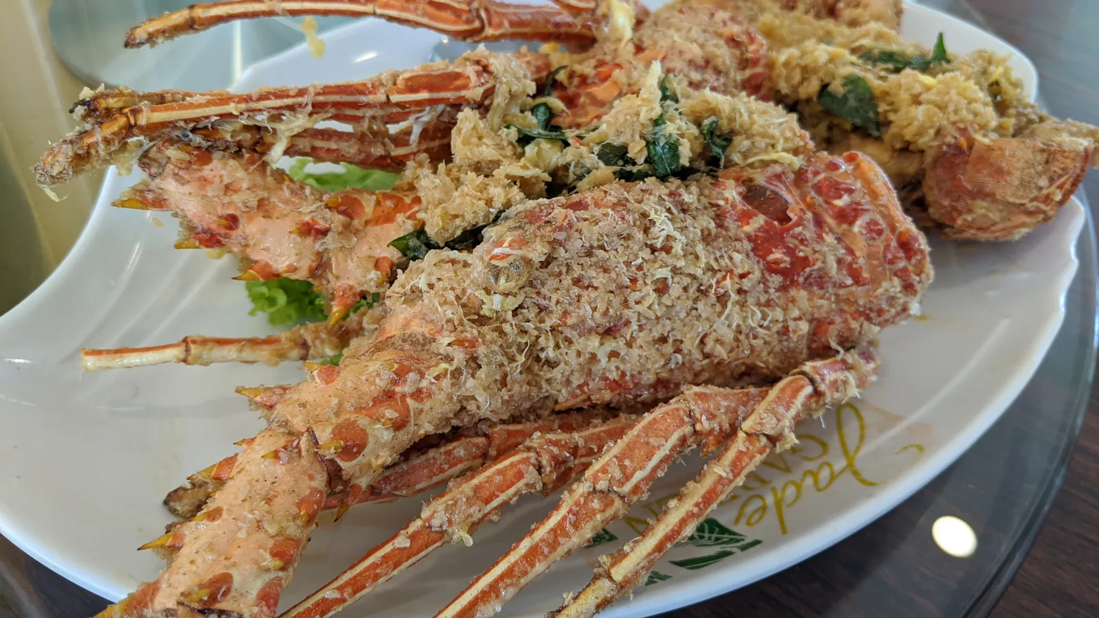 Plate of cereal-fried spiny lobster at a seafood restaurant in Sungai Rengit, south of Desaru