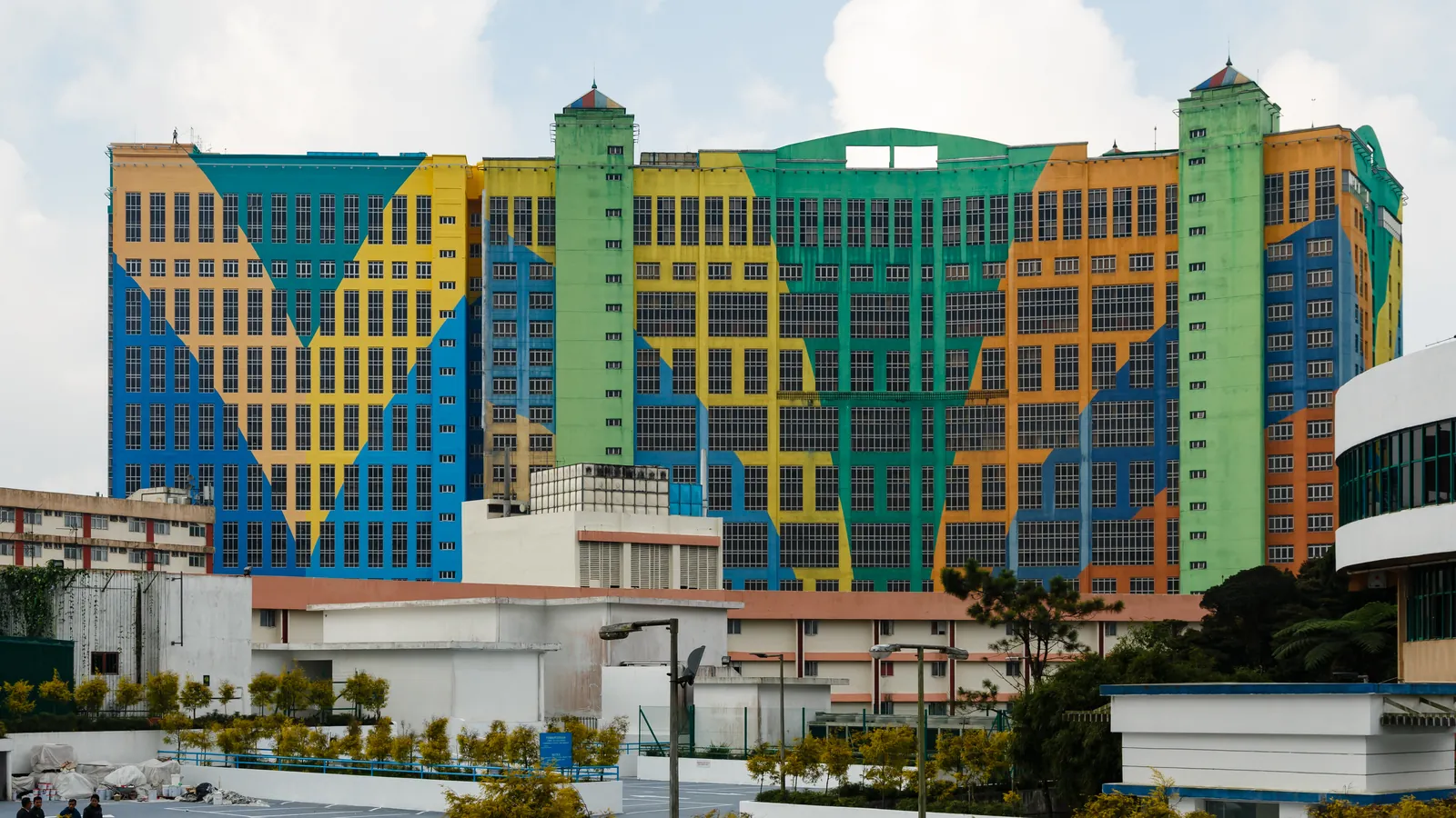 The colourful blue, yellow and green towers of First World Hotel at the peak of Genting Highlands