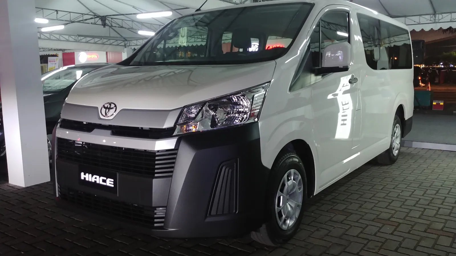 White Toyota HiAce Commuter van, the type of vehicle used for group trips from Singapore to Malaysia