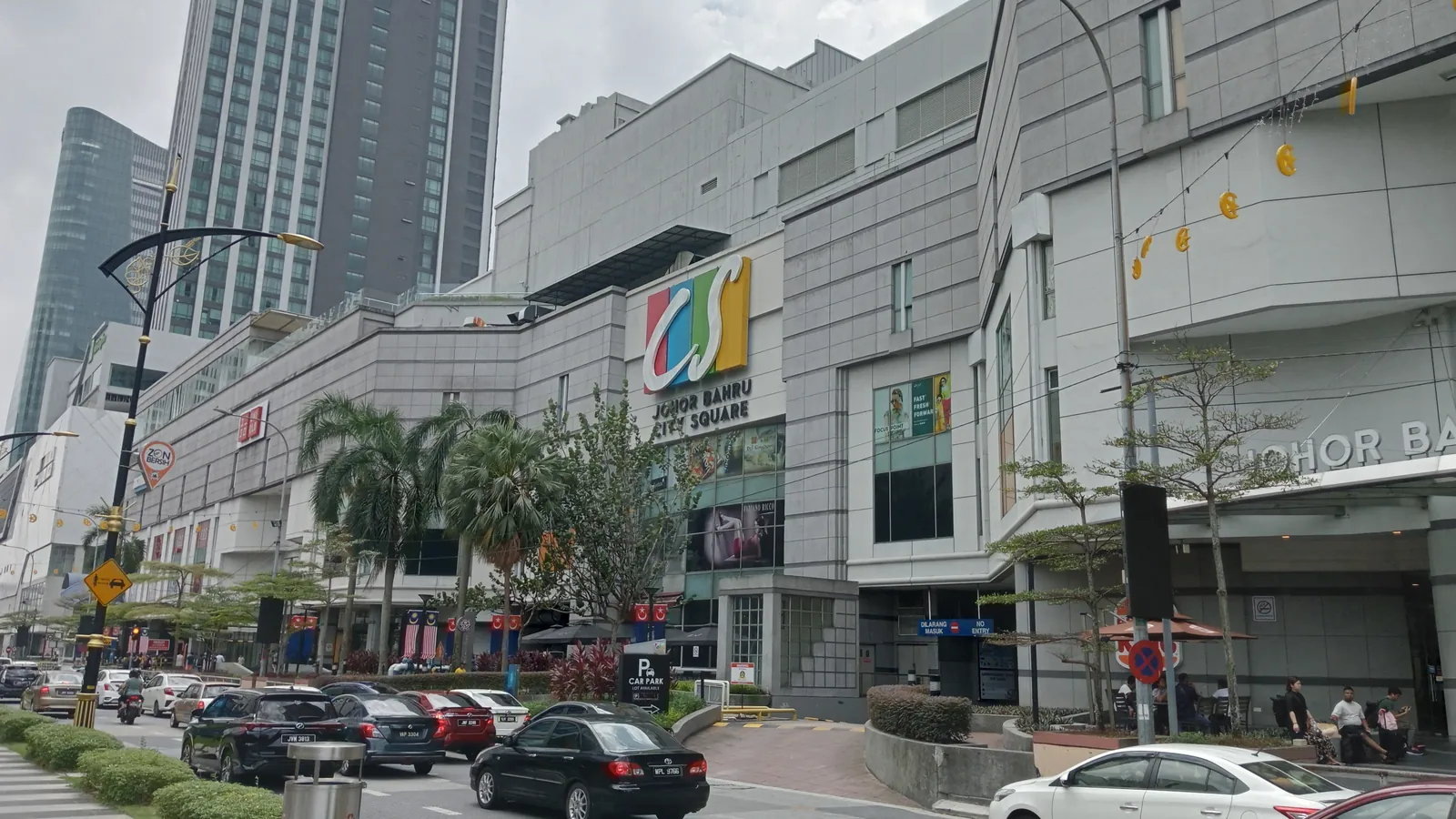 Johor Bahru City Square mall seen from Jalan Wong Ah Fook, with office towers behind and cars on the road in front