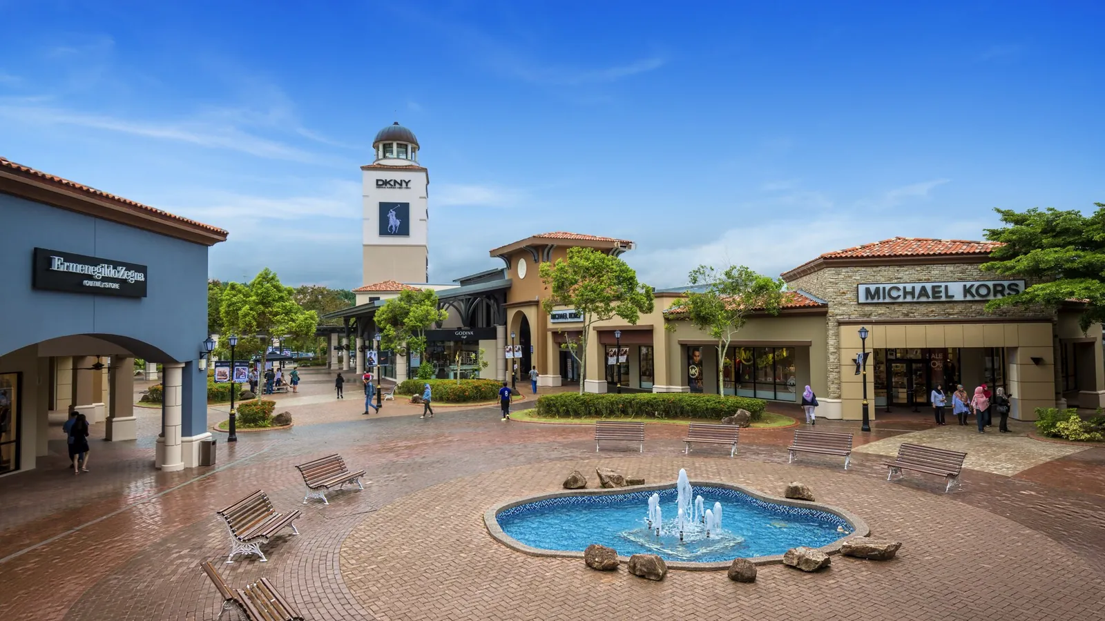 Fountain plaza and open-air walkways lined with designer outlet stores at Johor Premium Outlets, Indahpura, Kulai