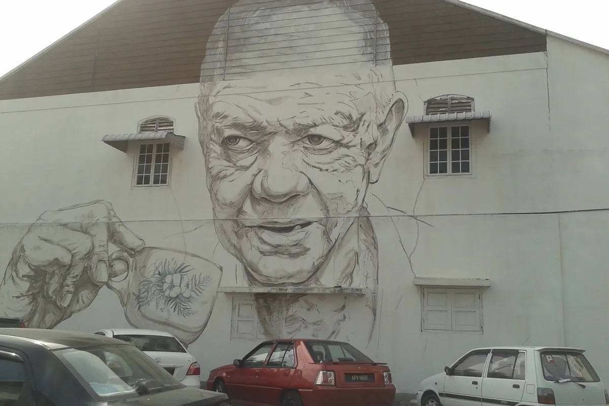 Old Uncle with White Coffee mural on a building wall in Ipoh Old Town
