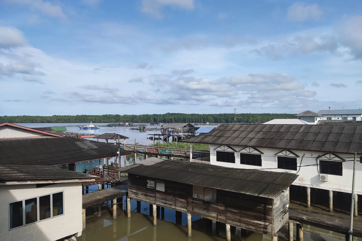 Wooden houses on stilts over the water at Kukup fishing village, Johor