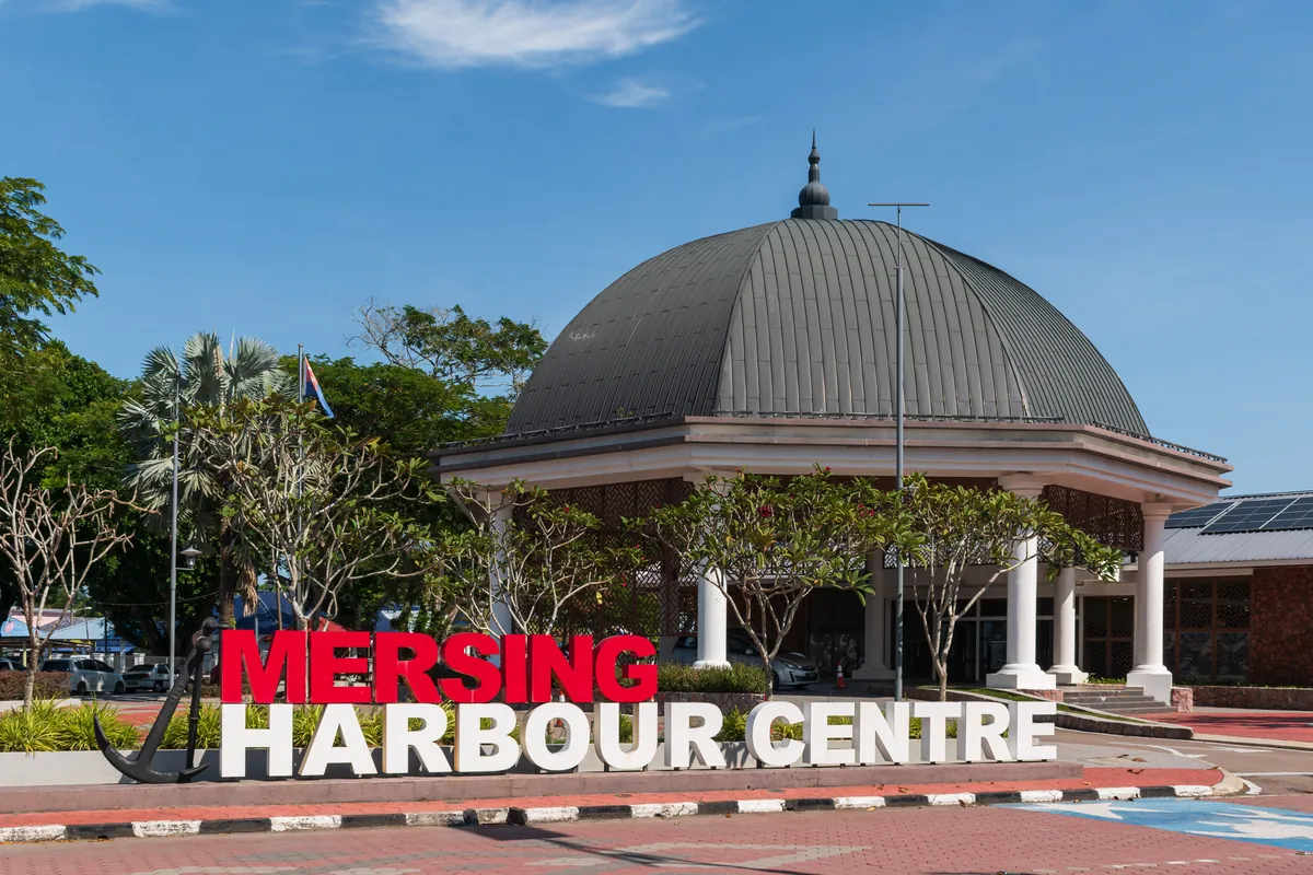 Domed Mersing Harbour Centre and its sign near the jetty in Mersing, Johor