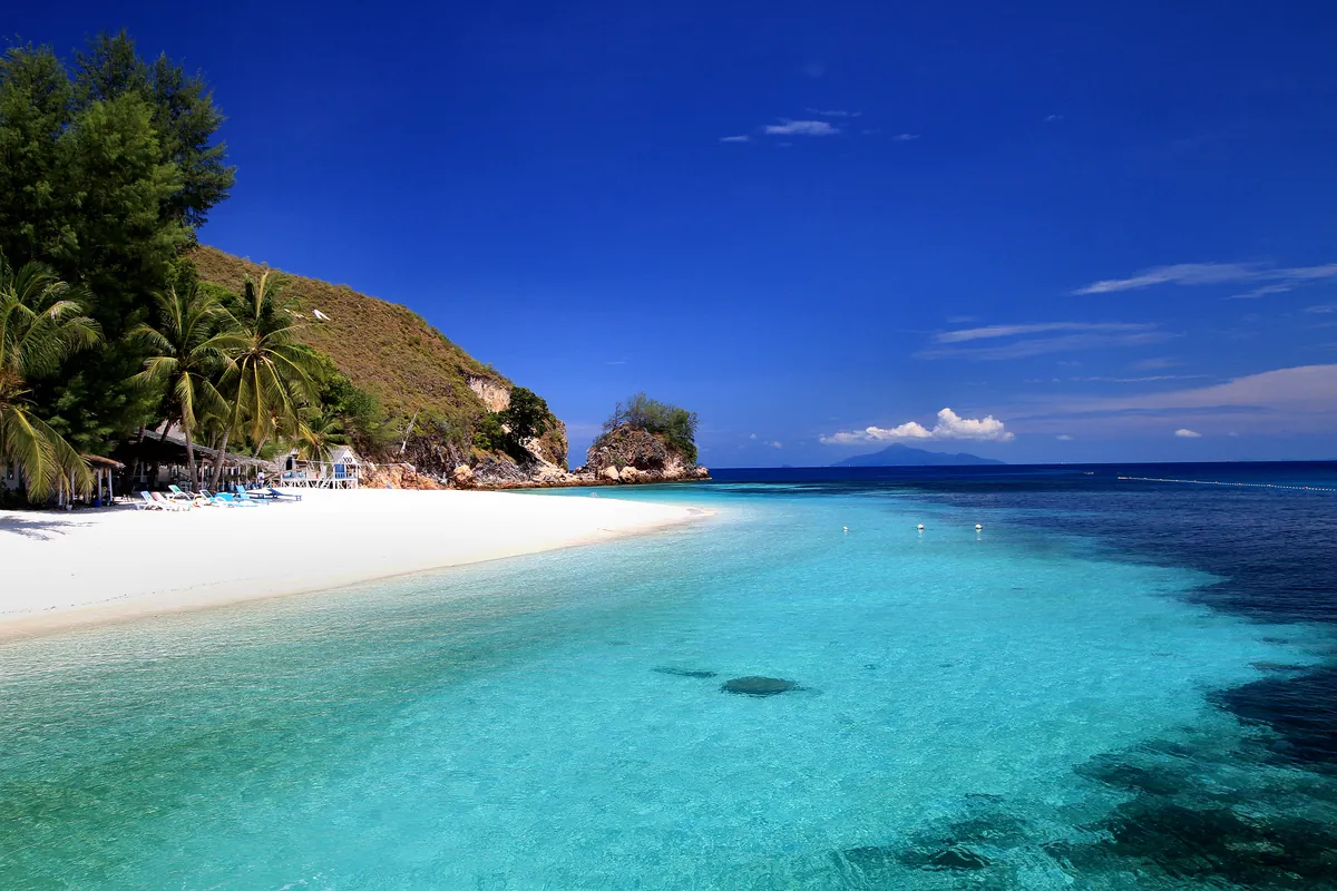 White sand and turquoise water on Rawa Island, reached by boat from Mersing