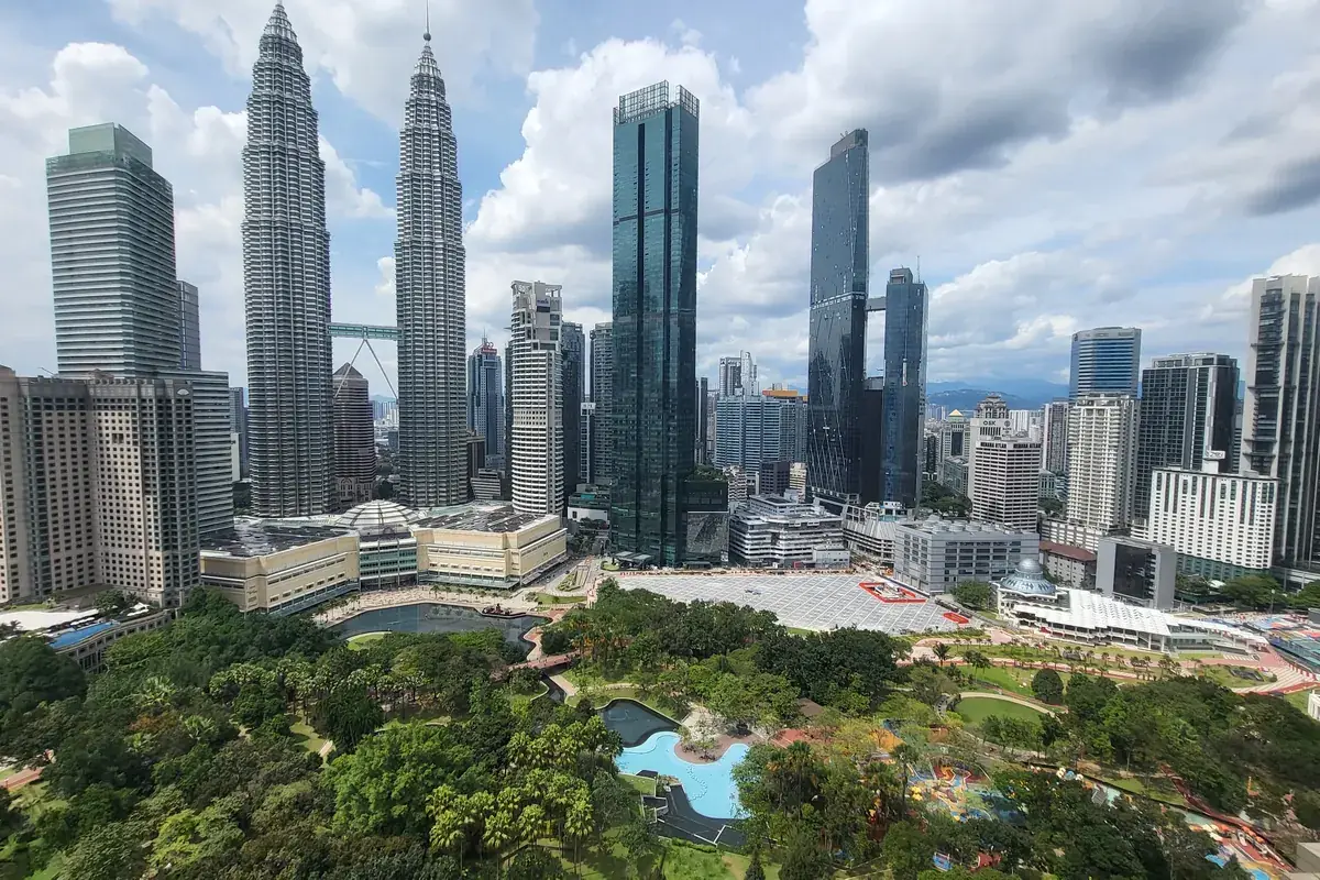 Petronas Twin Towers rising above KLCC Park in Kuala Lumpur