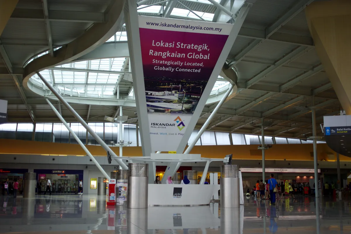 Main terminal hall of Senai Airport with its curved steel roof