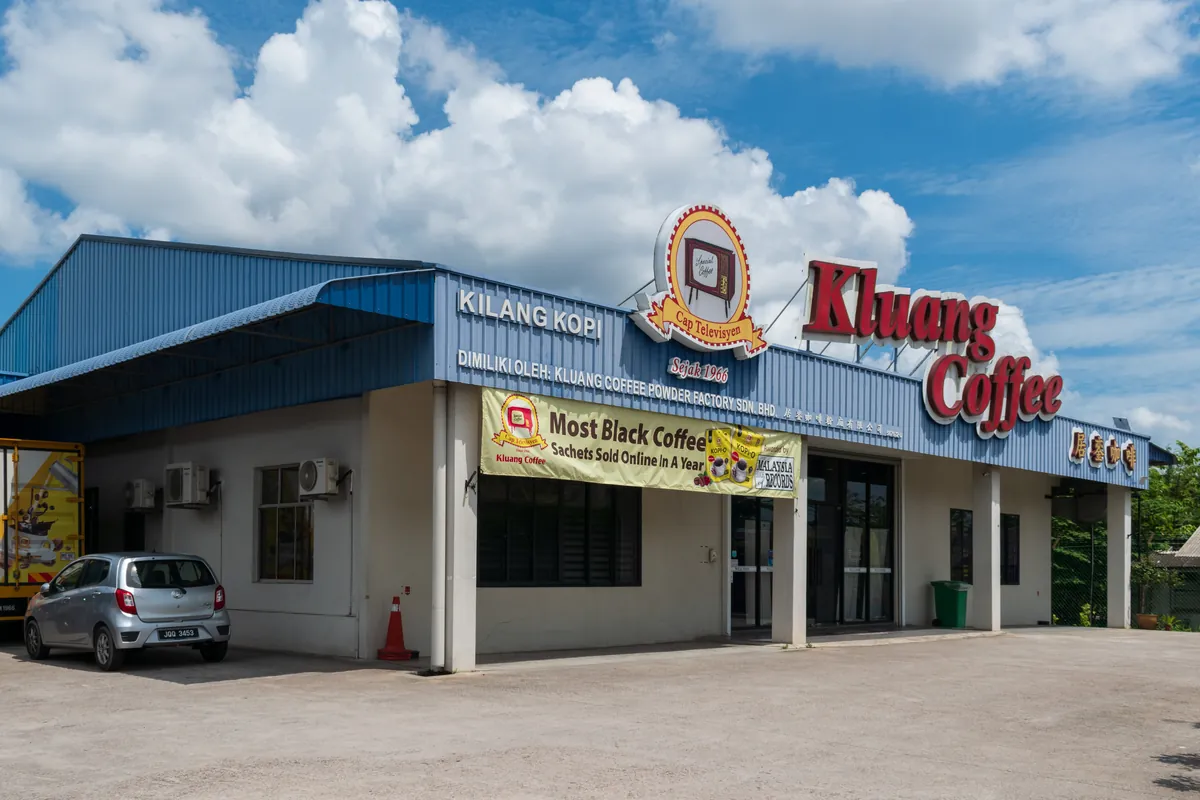 Kluang Coffee Powder Factory building under a blue sky, Johor
